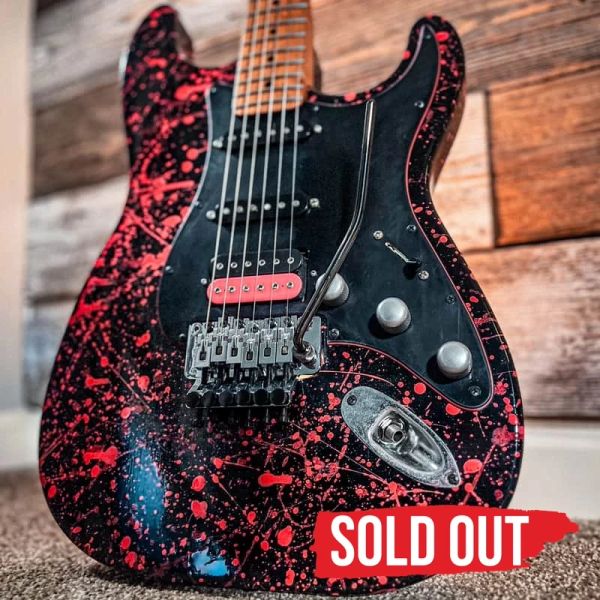 Sold out: Flaunt Your Flare #1020, black and pink JTal guitar with a Floyd Rose bridge