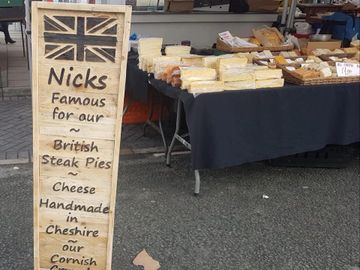 Rustic business shop front signage.  Advertisement hoarding.  Wood business signage.