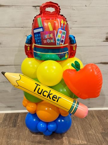 Mini balloon tower with themed topper and custom name—perfect for gifts, parties, or small spaces.