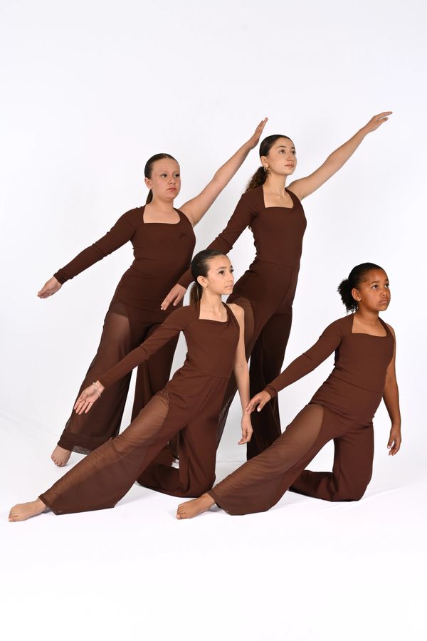 Four girls in brown dance costumes striking elegant poses against a white background.