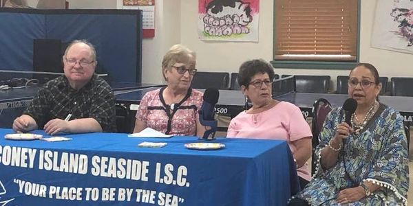 Participants of the Coney Island Oral History project tell stories at a live event in New York.