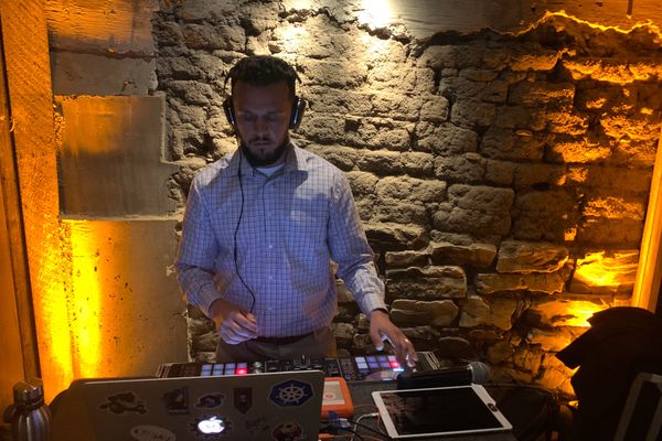 DJ mixing music at a wedding reception.