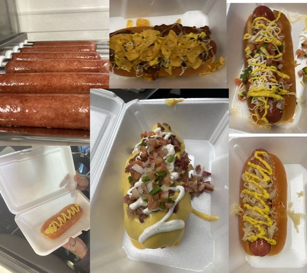 Various gourmet hot dogs with multiple toppings in styrofoam containers.