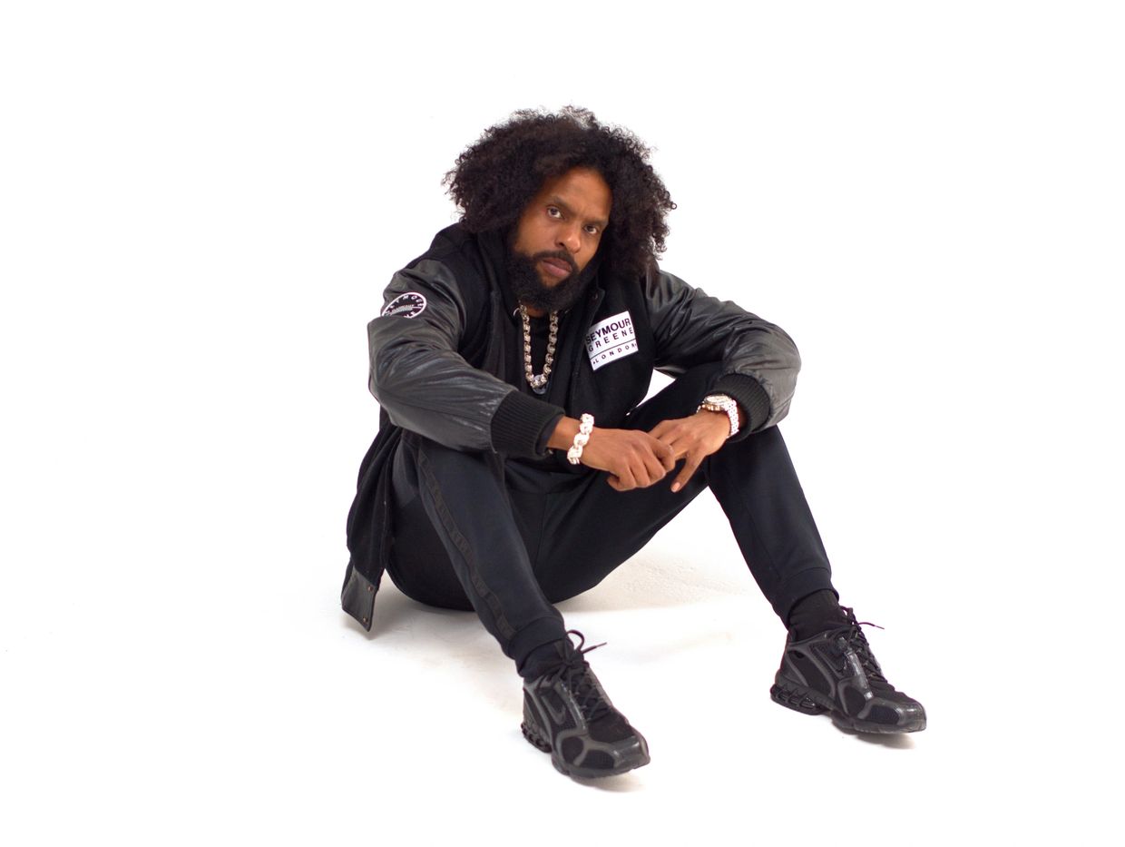 Flash Spacey Sitting in an all white photography studio in West London