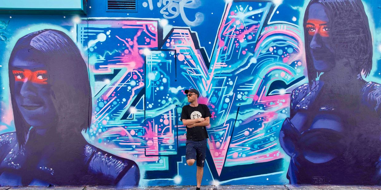 Professional Behind-the-scenes photography in London, street artist in by mural - flash spacey