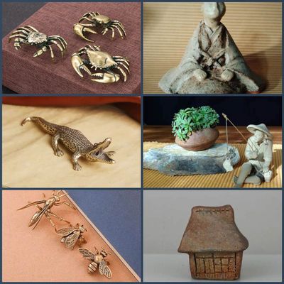 Three brass crab figurines and clay mud men 
