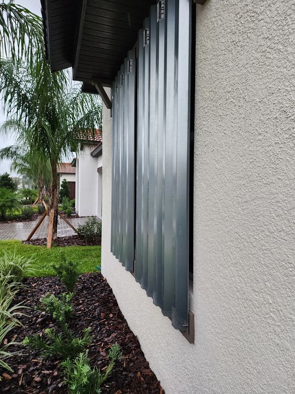 Vacant home hurricane shutters secured in Sun City Center, FL