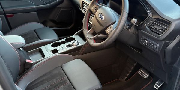 Modern Ford car interior with ST Line branding and sporty design.
