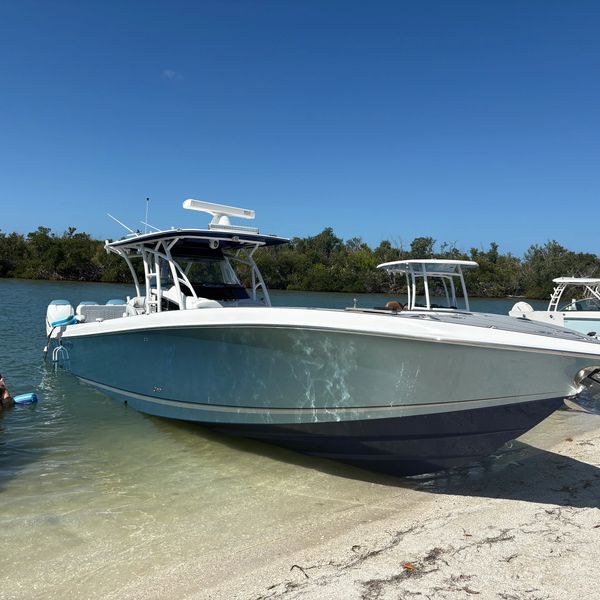 Boats docked by the shore on a sunny day.