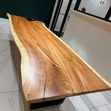 Long wooden table with natural edges.