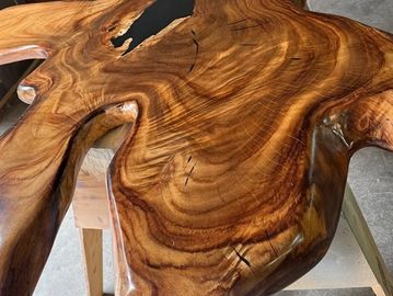 Polished wood slab with natural grain patterns.