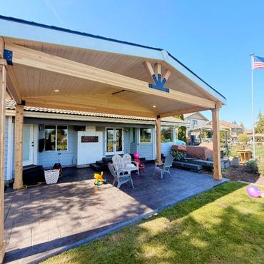 outdoor gable patio cover on stamped concrete patio
