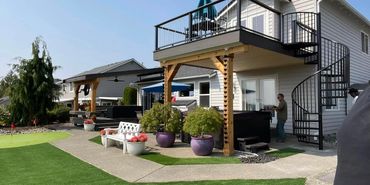 double decks on back yard. Matching new decks one second story and one deck with patio cover.