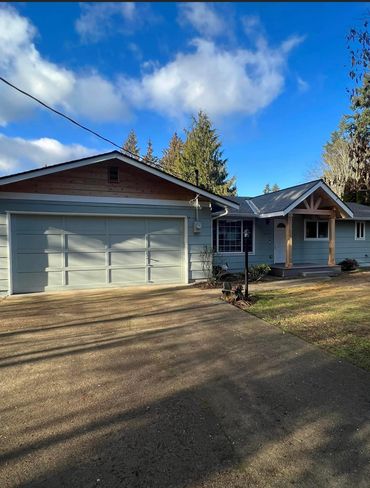 Garage with concrete foundation in front yard