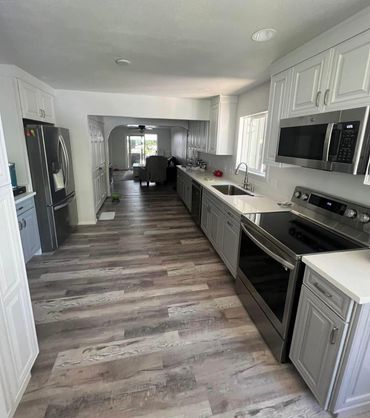 interior finished room with new floors and granite countertops. 