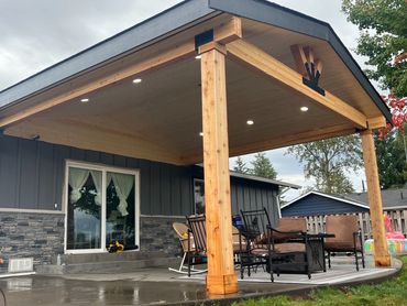 gable patio cover with outdoor lighting