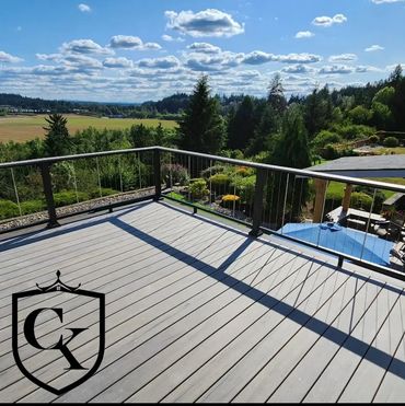 Composite deck with cable railing built by general contractor