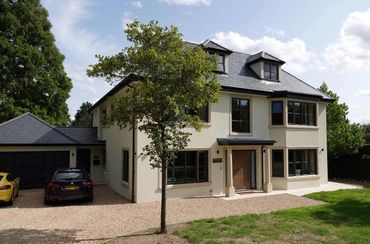 Front elevation of extended and remodelled house with 6 bedrooms, Reigate