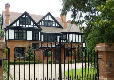 View from entrance gates of a remodelled and extended Edwardian House in Weybridge. 