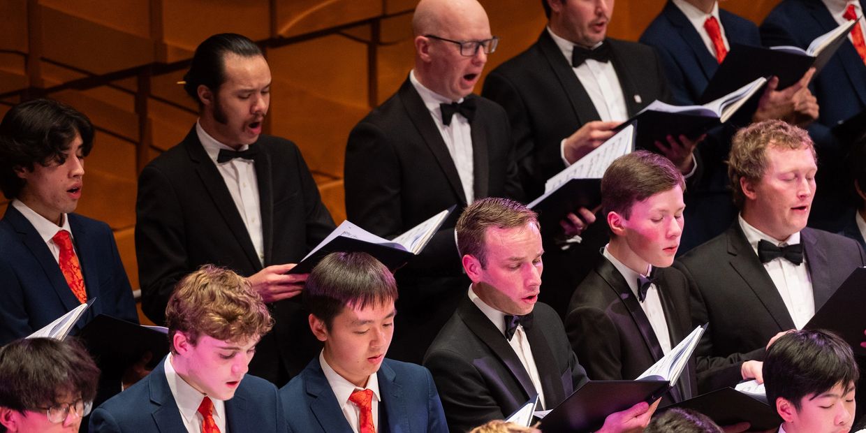 Group of alumni choristers singing together at National Boys Choir 60th Anniversary Concert