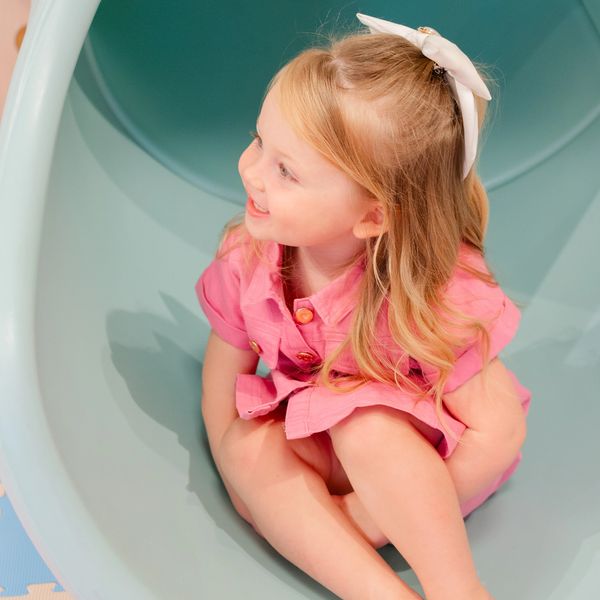 a little girl enjoys her birthday party at the pink flamingo party event space.