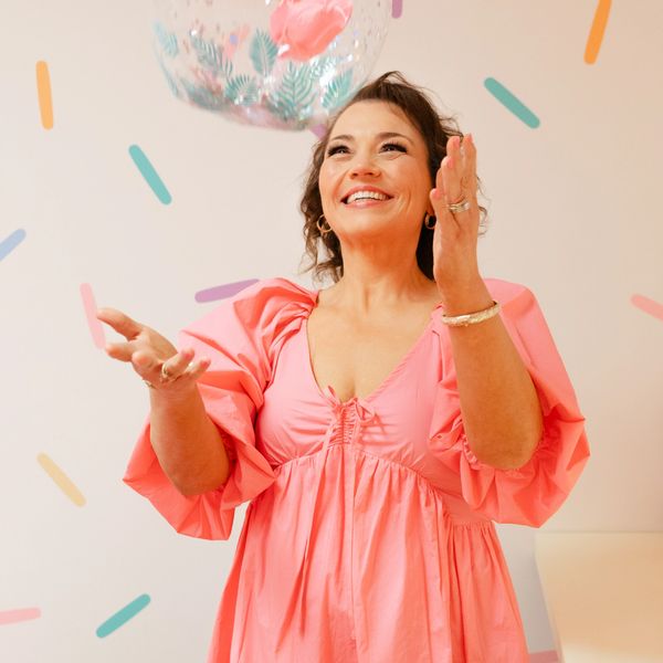 the co-owner of the pink flamingo play cafe, Cheri, prepares the party room for an event.