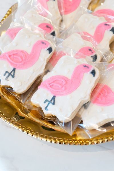 pink flamingo cookies on a tray.