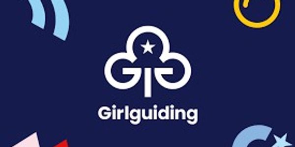 Girlguiding logo on a dark background.
