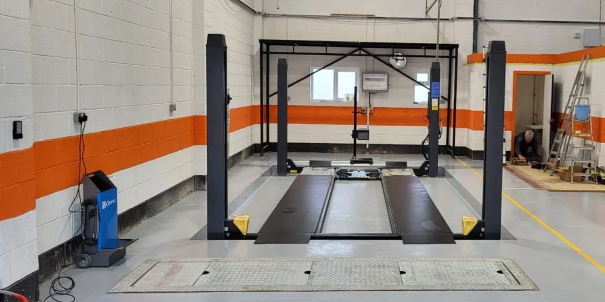 Vehicle inspection lift inside a garage.