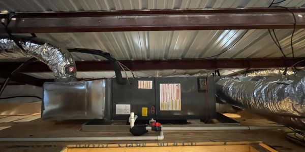 Ceiling-mounted HVAC system ductwork.