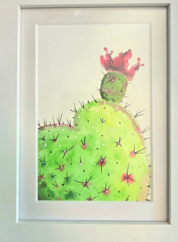 watercolor painting of a cactus with a pink blossom in a white frame