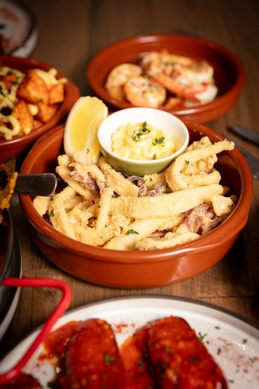 Fried Calamari - Lightly battered deep-fried calamari served with aioli.