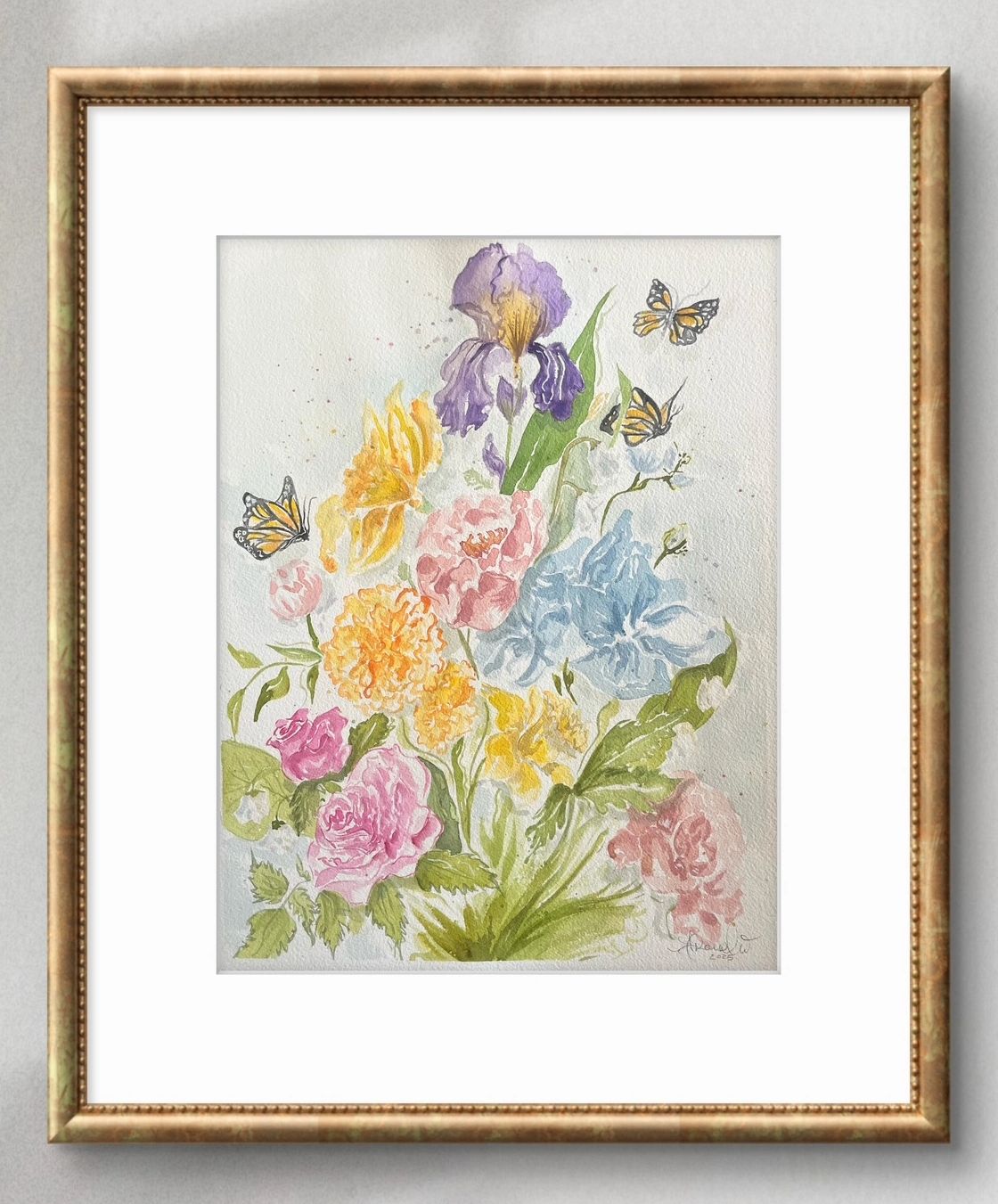 Watercolor painting of colorful flowers and butterflies in a gold frame.