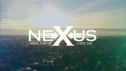 Nexus logo over cityscape at sunset.