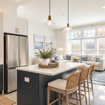 Modern kitchen island with wicker stools and natural decor.