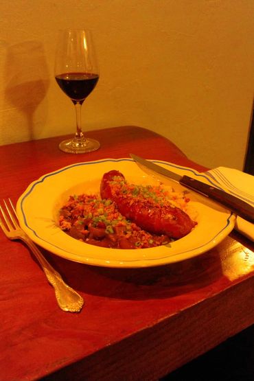 Andouille Sausage overtop of Red Beans and Rice
