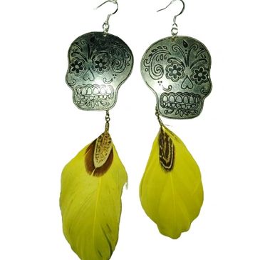 Day of the dead skulls with yellow feathers.