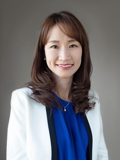 Sharon Chun, Mount Prospect implant dentist, posing for photo for Shine Dental 