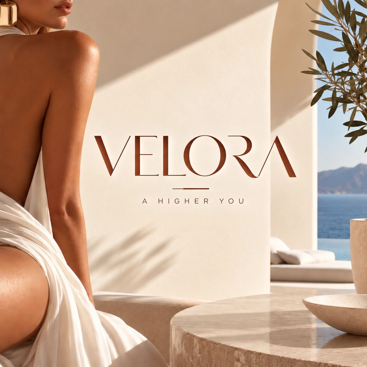 Luxury resort branding with ocean view and a woman's arm.