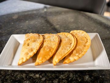 Golden, flaky pastry filled with seasoned ground beef Cuban-style. Savory and satisfying.