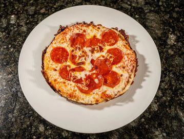 Cuban-style pizza with classic pepperoni, tomato sauce and melted mozzarella.