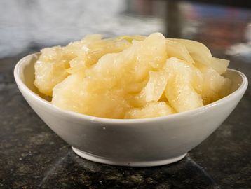 Tender yuca topped with a flavorful garlic mojo sauce, a classic Cuban favorite.