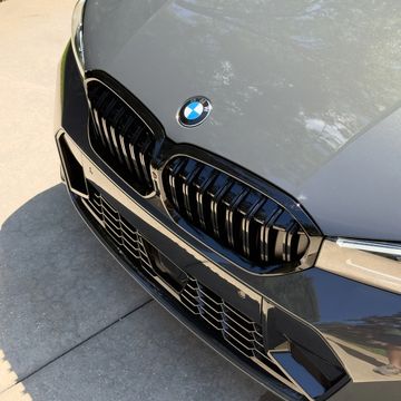 Close-up of a BMW car grille and emblem.