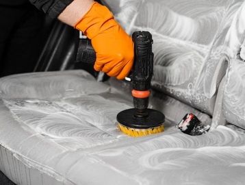 Deep cleaning a vehicle seat as part of our professional Full Detail service.