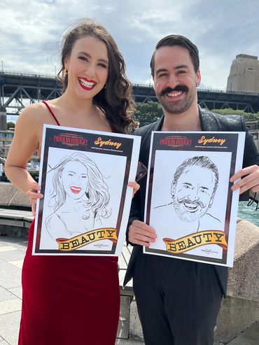 Sydney cast members holding their caricatures.