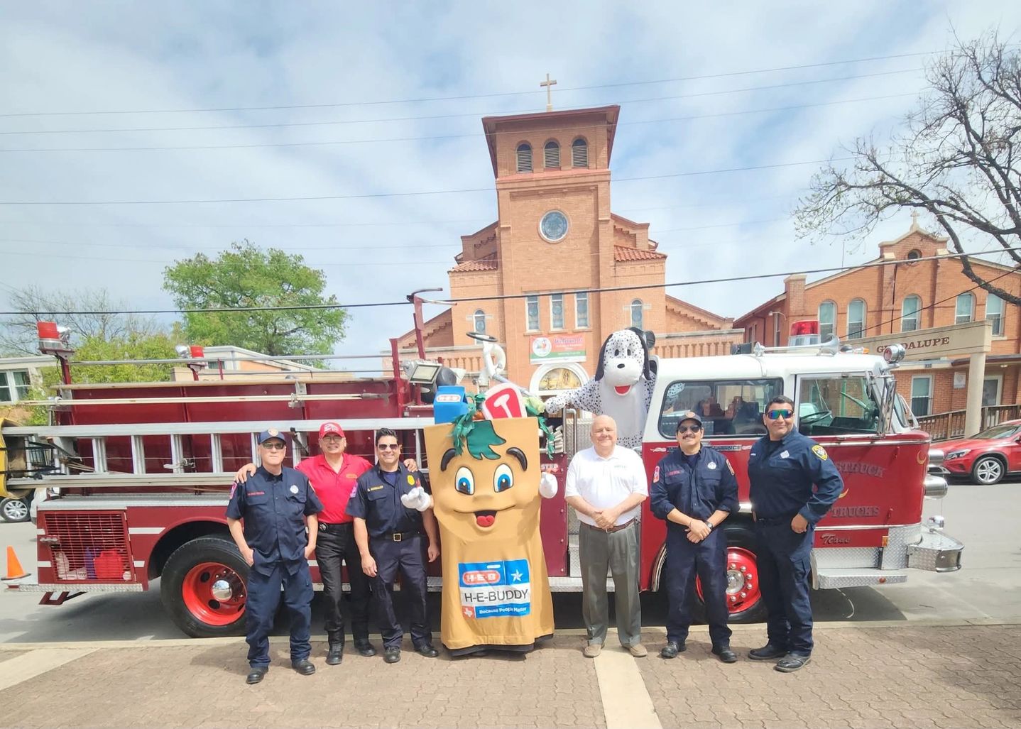 Moonstruck Foundation antique firetruck at a community parade
