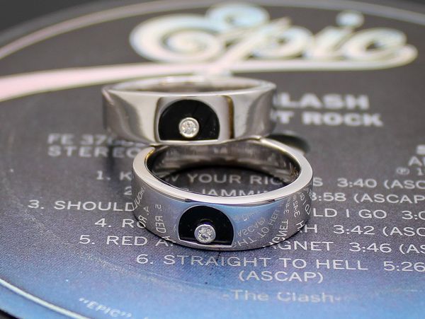 Original 14k white gold wedding bands with The Clash's Vinyl Record inlay and bezel set diamond.