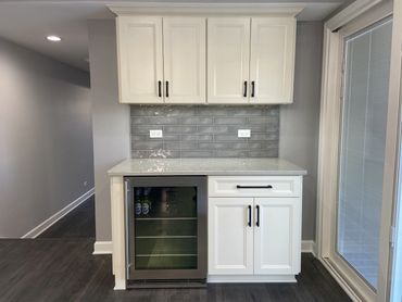 Kitchen remodel with white cabinet and wine cooler 