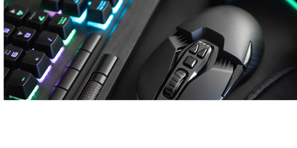 Close-up of a gaming keyboard with RGB lighting and a high-tech mouse.