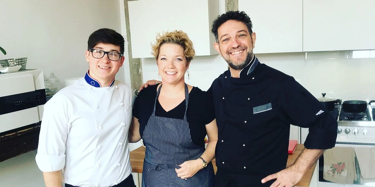 Registered dietitian nutritionist, Kasey Gamble Lobb, in the kitchen with two chefs in Italy
